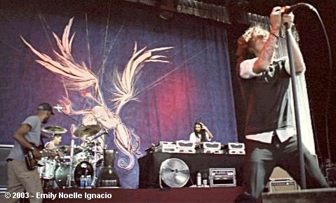 photo of bassist Ben Kenney, drummer Jose Pasilla, DJ Kilmore, and singer Brandon Boyd copyright Emily Noelle Ignacio